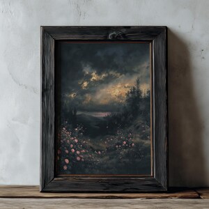 May include: A framed landscape painting with a dark, stormy sky and a field of pink flowers. The painting is in a black wooden frame. The text "DARKENEBRUSH" is at the top.