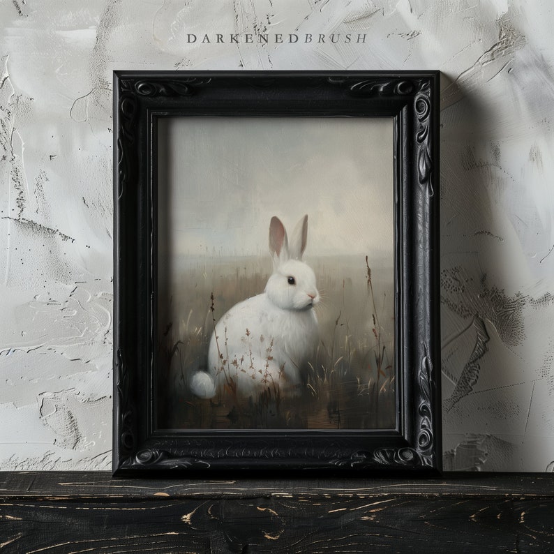 May include: A white rabbit sits in a field of tall grass. The rabbit is facing to the right and has its ears perked up. The background is a soft, blurry landscape.