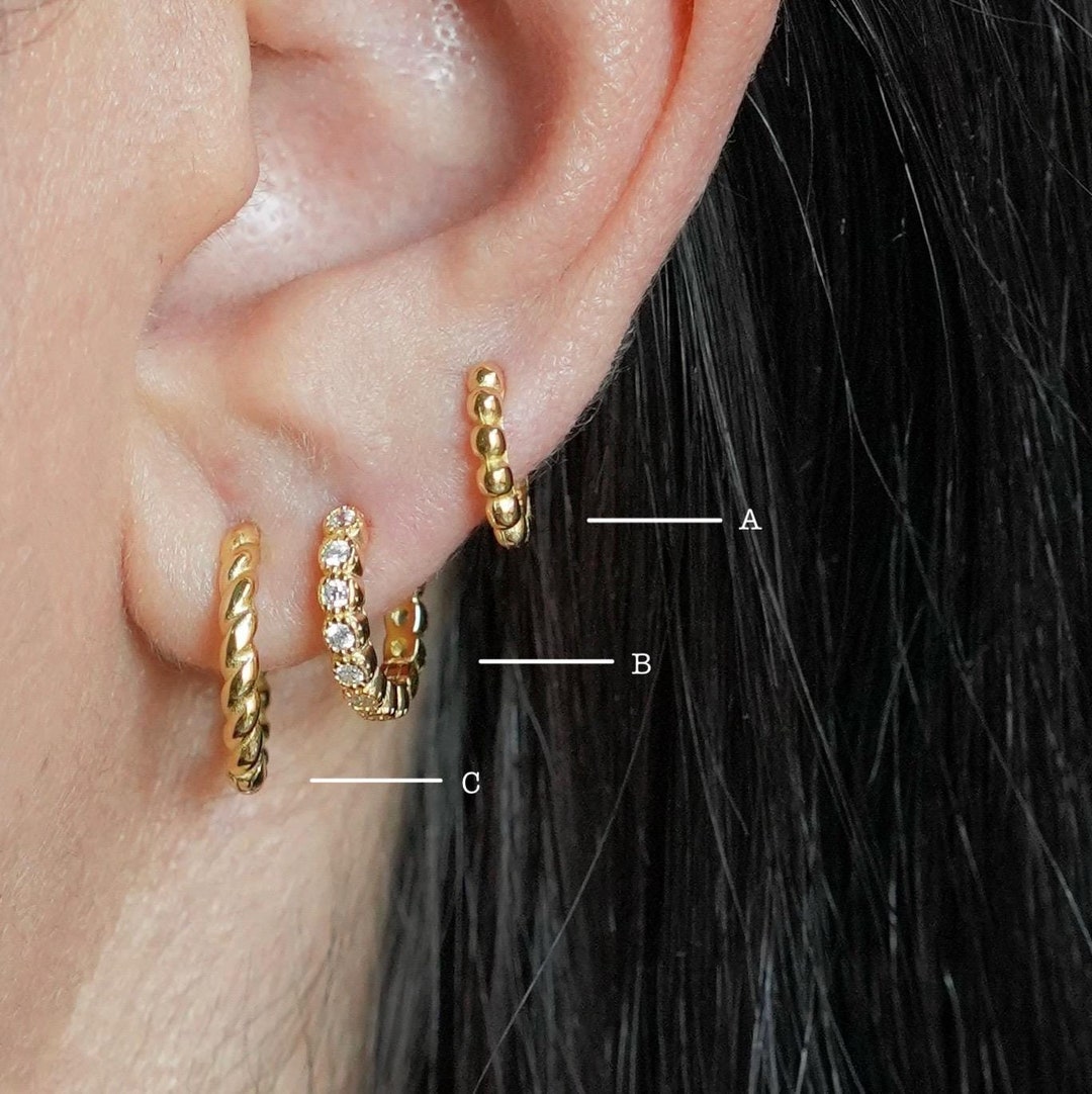 Amber Twisted Huggie Hoop Earrings in Shiny Gold main image 0