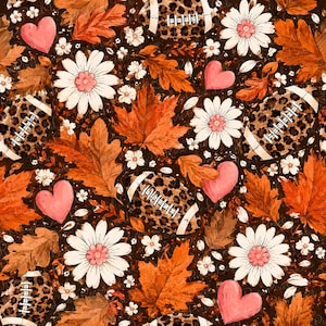 May include: A seamless pattern featuring footballs with a brown leopard print, orange maple leaves, white daisies with pink centers, and pink hearts on a dark brown background. The design repeats these elements across the entire surface.