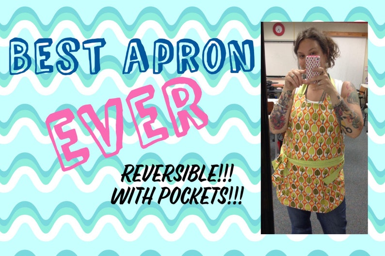 May include: A woman wearing a green and orange reversible apron with pockets. The apron has a pattern of green leaves and orange circles. The text "BEST APRON EVER REVERSIBLE!!! WITH POCKETS!!!" is written on a blue and white wavy background.