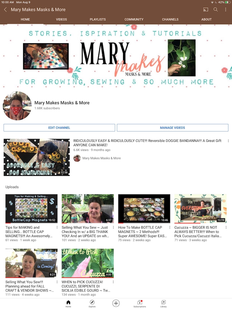 May include: A screenshot of a YouTube channel page for "Mary Makes Masks & More". The channel features videos on sewing, gardening, and crafting. The banner image features the channel name in a colorful font with a floral design. The channel has 1.68K subscribers. The featured video is titled "RIDICULOUSLY EASY & RIDICULOUSLY CUTE!!! Reversible DOGGIE BANDANNA!!! A Great Gift ANYONE CAN MAKE!" and has 6.6K views.