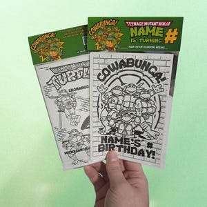 May include: Teenage Mutant Ninja Turtles birthday party favors. The favors include coloring pages with the words "Cowabunga!" and "Name's Birthday!" printed on them. The top of the favors have the words "Teenage Mutant Ninja" and "Name is Turning".
