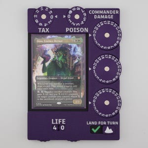 May include: A purple Magic: The Gathering life counter with dials for tax, poison, and commander damage. The card "Dina, Essence Brewer" is displayed in the center. The life counter shows "LIFE 40" and "LAND FOR TURN".