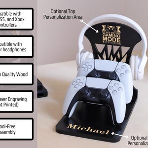 May include: Black wooden gaming controller and headphone stand with white controllers and headphones. The stand has the text "DO NOT DISTURB GAMING MODE ACTIVATED" and the name "Michael". It is compatible with PS4, PS5, and Xbox controllers.