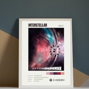 May include: Framed movie poster for the film "Interstellar" with a space scene and the title in bold white letters. The poster includes the year 2014, credits, and a Spotify code. The color palette features shades of red, purple, and black.