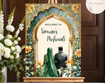 Op de afbeelding: Een welkomstbord voor een Mehndi-viering met een gouden en groene boog, een stel dat op een schommel zit en de tekst "Welkom bij Simran's Mehndi".