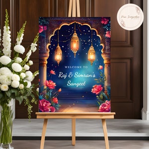 May include: A welcome sign for a Sangeet celebration with a blue background and a golden archway decorated with hanging lanterns. The text reads "Welcome to Raj & Simran's Sangeet".