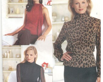 Butterick 6878 Size 18, 20, 22 Chetta B sewing pattern.  Sleeveless or long sleeve blouse, optional peplum, high neckline top