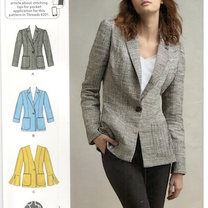 May include: A sewing pattern for a blazer, featuring a close-up of a woman wearing a grey blazer with black trousers. The pattern includes three different views of the blazer: a classic blazer, a striped blazer, and a yellow blazer. The pattern is for sizes US 16-24, Talla Euro 42-50, and Taille FR 44-52. The pattern is Simplicity S8844 U5.