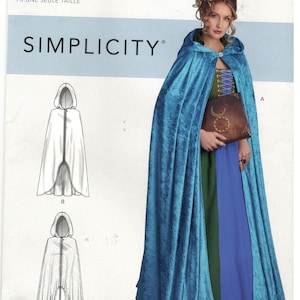 May include: A sewing pattern for a costume with a hooded cape. The pattern is for one size and includes instructions for making a blue cape with a hood, a white cape with a hood, and a white cape with a hood and a ruffled hem. The pattern is from Simplicity and the pattern number is R10728.