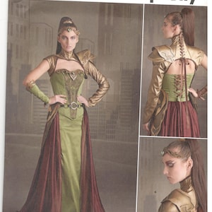 May include: Simplicity pattern 8363 R5 presents a fantasy costume design. The image displays a green and burgundy gown with gold detailing, such as a bodice, sleeves, and shoulder armour. The pattern includes sizes 14-22.