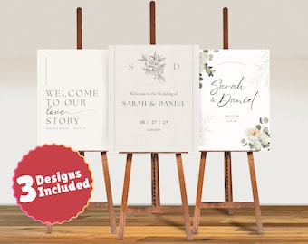 May include: Three wedding sign designs on wooden easels. The signs feature elegant fonts and floral accents. One sign reads "Welcome to our love story," another says "Welcome to the Wedding of Sarah & Daniel," and the third says "Sarah & Daniel."