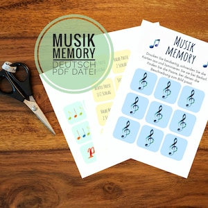 May include: A printable PDF file for a German music memory game. The game features a treble clef symbol and musical notes. The text on the page reads "Musik Memory Deutsch PDF Datei".