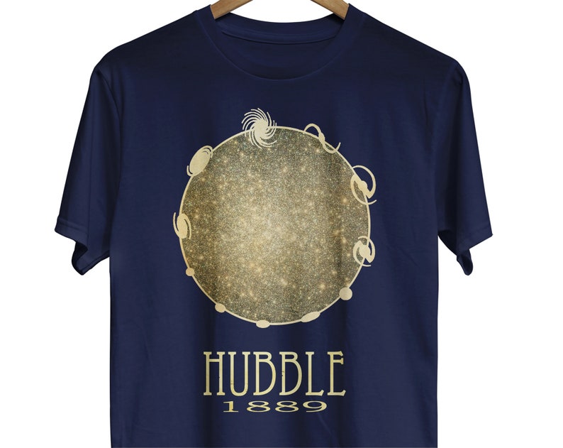 May include: Navy blue t-shirt with a gold glitter design of a galaxy with the text "HUBBLE 1889".