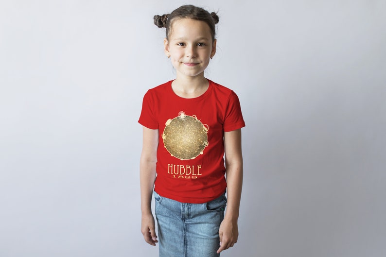 May include: A red t-shirt with a gold graphic of a galaxy and the text "HUBBLE 1990".