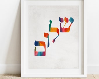 May include: A colorful watercolor print of the Hebrew word "Shalom" meaning peace. The word is written in a stylized font with each letter in a different color.