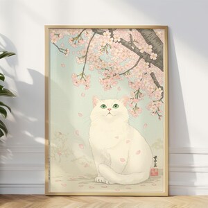 Elegante weiße Katze mit grünen Augen unter Sakura-Blüten – Kirschblüten-Kunstdruck im japanischen Stil für eine sanfte ästhetische Wohndekoration