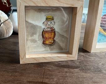 Original Gouache painting 4x4 honey bear SWEET in a light wood recessed frame.