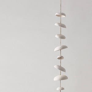 Mudpuppy Moon wind chimes organic hanging disc bells sculpture natural buff stoneware image 1