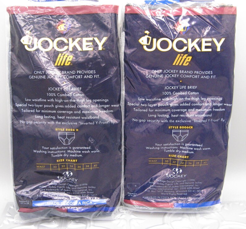 May include: Two packages of Jockey Life briefs made of 100% combed cotton. The dark blue packaging features white text detailing features like a low waistline, two-layer pouch, and Inverted Y-Front fly, with a size chart for waists 30 to 40 inches.