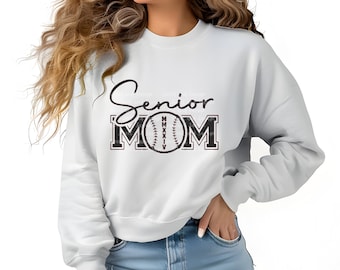 May include: A light blue sweatshirt with the text "Senior Mom" in black with a baseball graphic in the middle of the word "Mom".