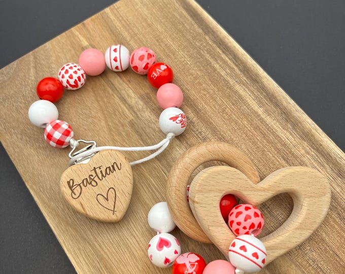 Personalized Valentine’s Day Pacifier Clip and Rattle, hearts and kisses in red and white with pink, baby boy and girl shower gift
