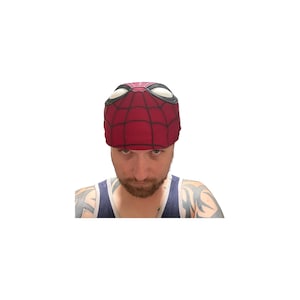 May include: A red and black Spider-Man mask with white eye details. The mask features a web pattern design and is worn on the head. The mask is made of a soft material.