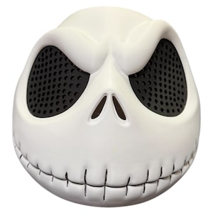May include: A white mask resembling Jack Skellington from The Nightmare Before Christmas. The mask has large, oval eye openings with black mesh, a stitched mouth, and a slightly furrowed brow.