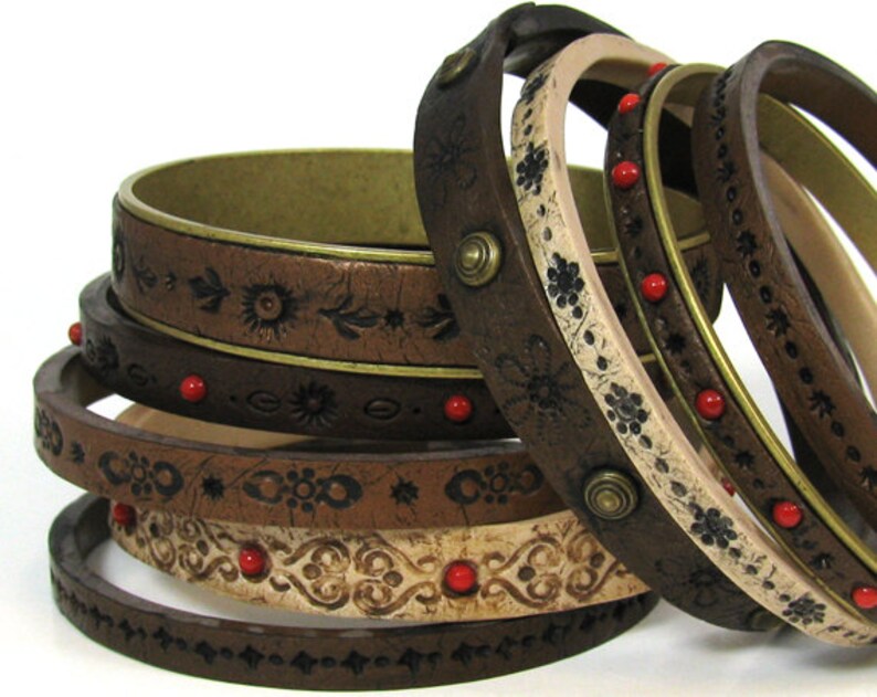 Examples of polymer clay bracelet designs explained in Eugena's Faux Leather Bracelets tutorial.