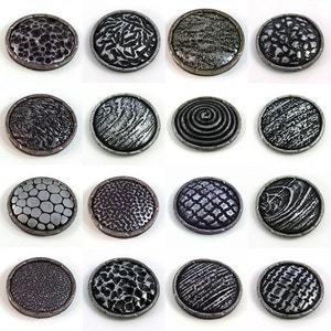 More than 30 different ideas of hand-made textures on polymer clay are shown on the domed and framed beads described in this step-by-step tutorial.