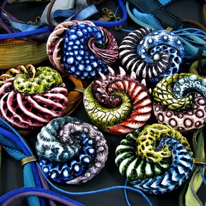 Seven finished necklaces made with the techniques explained in this polymer clay tutorial Sea Creatures