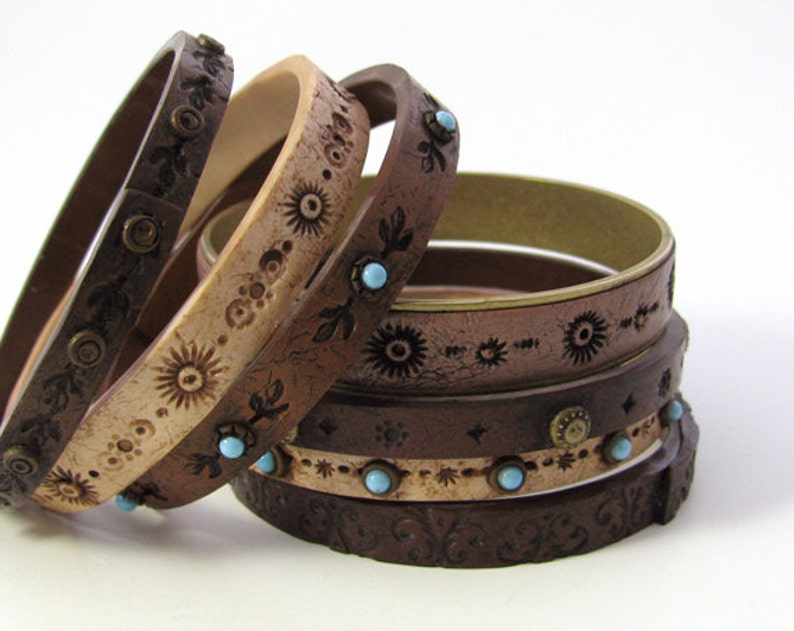 Examples of polymer clay bracelet designs explained in Eugena's Faux Leather Bracelets tutorial.