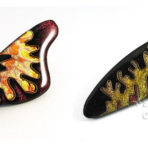 Two examples of polymer clay  Faux Cloisonne pins with abstract designs.