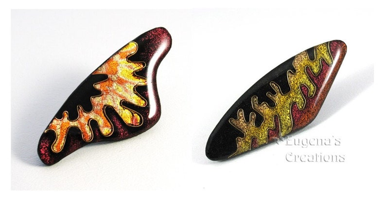 Two examples of polymer clay  Faux Cloisonne pins with abstract designs.