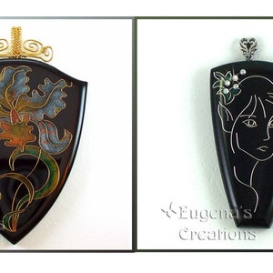 Two examples of Faux Cloisonne pendants to demonstrate the possibilities of this technique.  One is with an orchid design and another is with a face.