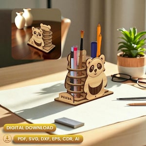 May include: A wooden panda-themed desk organizer with multiple compartments for pens, pencils, and art supplies. The organizer features a panda bear design and the word "PANDA" on the base. The image also shows a small plant, glasses, and other desk items.