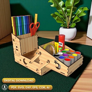 May include: A wooden desk organizer with compartments for art supplies. It features a rocket and star design, holding markers, scissors, paint pots, tape, and glue. The text "DIGITAL DOWNLOAD" and file type icons are visible.