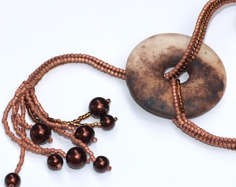 Lalita / Beadwoven Necklace with Smoke Fired Clay Donut Focal Pendant / Copper Beads and Faux Pearls / Earthy Colors / Ndebele Necklace