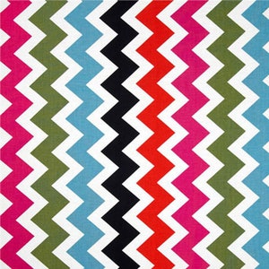 May include: A colorful chevron pattern fabric with alternating stripes of pink, green, blue, black, red, and white.