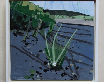 May include: An abstract painting of a waterscape in a white frame. The artwork features a dark blue body of water with green reeds and foliage. The background includes a green hillside and a light blue sky.