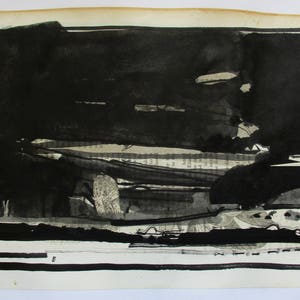 May include: Black and white abstract art print with a collage of text and paper. The print is framed with a black border.