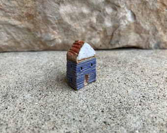 kiln fired clay house bead, grayblue house with a yellow roof