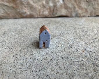 kiln fired clay house bead, grayblue house with a yellow roof