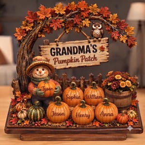 May include: A decorative autumn-themed display featuring a scarecrow holding a pumpkin, a wooden sign reading "GRANDMA'S Pumpkin Patch" with an owl perched on top, and several pumpkins labeled with names including Tyson, Sophia, William, Jason, Henry, and Anna.