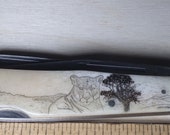 Scrimshawed Roper Double Action Trapper knife with Cougar.