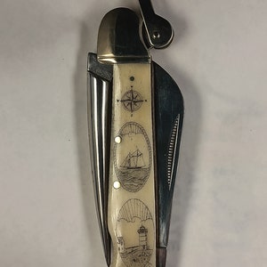 Scrimshaw-riggingmes met Cape Neddick-vuurtoren, schip en kompasroos