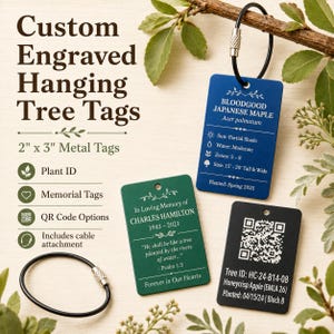 May include: Three rectangular metal tags measuring 2 inches by 3 inches, in blue, green, and black. The blue tag lists Bloodgood Japanese Maple details. The green tag is a memorial for Charles Hamilton. The black tag features a QR code.