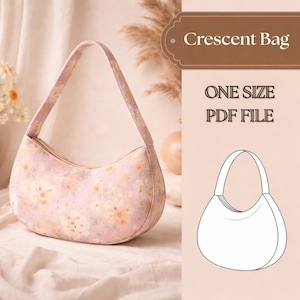Pode incluir: Uma bolsa meia-lua de tecido rosa claro com um padrão floral em tons de laranja e branco. O texto diz Crescent Bag, ONE SIZE e PDF FILE, acompanhado por um desenho de linha a preto e branco da forma da bolsa.