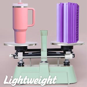 May include: A pink tumbler with a handle and straw on one side of a balance scale, and four purple racks on the other side. Text reads: Lightweight. Four racks weigh 1.4 lb (less than an empty tumbler). The scale is light green with silver plates.